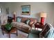 Living room featuring a comfortable sofa and decor at 6158 Palma Del Mar S Blvd # 116, St Petersburg, FL 33715