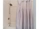 Simple bathroom with shower/tub combo and gray shower curtain at 6320 Grand Bahama Cir # 6320, Tampa, FL 33615