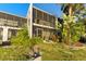 Building exterior showcasing lush landscaping and canal views at 6320 Grand Bahama Cir # 6320, Tampa, FL 33615