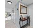 Bright hallway with tile flooring and console table at 6320 Grand Bahama Cir # 6320, Tampa, FL 33615