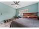 Bedroom with a queen-size bed and a built-in desk area at 6405 Julie St, Tampa, FL 33610