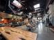 Large food hall with communal tables and various vendors at 6405 Julie St, Tampa, FL 33610