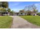 Newly renovated home with a landscaped yard at 6405 Julie St, Tampa, FL 33610