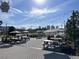 Outdoor patio area with picnic tables and string lights at 6405 Julie St, Tampa, FL 33610