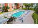 Community pool with surrounding lounge chairs at 6960 20Th N Ave # 307, St Petersburg, FL 33710