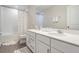 Bathroom with double vanity and colorful accents at 7878 Greenway Ave, Wesley Chapel, FL 33544