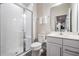 Clean bathroom with a walk-in shower and white vanity at 7878 Greenway Ave, Wesley Chapel, FL 33544