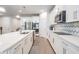 Modern kitchen with white cabinets and quartz countertops at 7878 Greenway Ave, Wesley Chapel, FL 33544