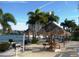 Relaxing waterfront patio with grills and picnic tables at 7930 Sun Island S Dr # 305, South Pasadena, FL 33707