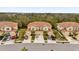 Aerial view of townhouses with tile roofs and attached garages at 8332 Enclave Way # 101, Sarasota, FL 34243