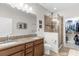 Elegant bathroom with double sinks, granite countertops, and a walk-in shower at 8332 Enclave Way # 101, Sarasota, FL 34243