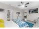 Bright bedroom with a queen-size bed and access to a walk-in closet at 8332 Enclave Way # 101, Sarasota, FL 34243