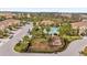 Aerial view of community pool and surrounding townhomes at 8332 Enclave Way # 101, Sarasota, FL 34243