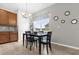 Breakfast nook with four chairs and view of the kitchen at 8332 Enclave Way # 101, Sarasota, FL 34243