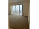 Living room with water views and sliding glass doors at 8800 Bay Pines Blvd # 220, St Petersburg, FL 33709