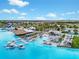 Aerial view of Crystal Lagoon with floating cabanas and lounge areas at 9228 Forge Breeze Loop Loop, Wesley Chapel, FL 33545