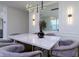 Modern dining room with marble table and stylish chairs at 9228 Forge Breeze Loop Loop, Wesley Chapel, FL 33545