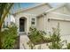 Front yard with walkway leading to house entrance at 9228 Forge Breeze Loop Loop, Wesley Chapel, FL 33545