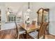 Dining room with hardwood floors, wooden table and hutch at 9232 Brindlewood Dr, Odessa, FL 33556