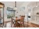 Dining room with hardwood floors and wooden table at 9232 Brindlewood Dr, Odessa, FL 33556