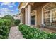 Front porch with columns, a bench, and potted plants at 9232 Brindlewood Dr, Odessa, FL 33556