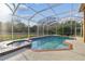 Inviting screened pool and spa with expansive backyard views at 9232 Brindlewood Dr, Odessa, FL 33556