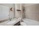 Clean bathroom with a single vanity and bathtub at 954 Old Windsor Way, Spring Hill, FL 34609