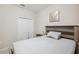 Small bedroom with a full-size bed and closet at 954 Old Windsor Way, Spring Hill, FL 34609