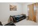 Cozy bedroom with a twin-size bed and gold curtains at 954 Old Windsor Way, Spring Hill, FL 34609