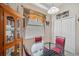 Breakfast nook with glass table, red chairs, and built-in hutch at 954 Old Windsor Way, Spring Hill, FL 34609