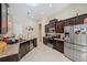 Modern kitchen with stainless steel appliances and granite countertops at 954 Old Windsor Way, Spring Hill, FL 34609