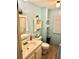 Bathroom with sink, toilet, and built-in shelving at 9790 66Th N St # 425, Pinellas Park, FL 33782