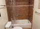 Bathroom with shower/tub combo and brown tile at 103 Old Mill Pond Rd, Palm Harbor, FL 34683