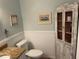 Charming bathroom with granite countertop and linen cabinet at 103 Old Mill Pond Rd, Palm Harbor, FL 34683