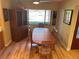 Dining room features hardwood floors and a wood dining table at 103 Old Mill Pond Rd, Palm Harbor, FL 34683