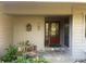 Home's exterior with a wood door and stone pathway at 103 Old Mill Pond Rd, Palm Harbor, FL 34683