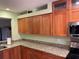 Well-equipped kitchen with ample cabinetry and granite counters at 103 Old Mill Pond Rd, Palm Harbor, FL 34683