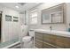 Modern bathroom with a large walk-in shower and updated vanity at 1030 Charles St, Clearwater, FL 33755