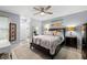 Spacious bedroom with ceiling fan, large bed, and neutral decor at 1030 Charles St, Clearwater, FL 33755