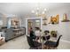 Charming dining area with glass table and four black chairs at 1030 Charles St, Clearwater, FL 33755