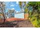 Backyard with mulch, trees, and wooden fence at 1039 10Th N St, St Petersburg, FL 33705