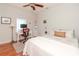 Bedroom with a queen-size bed, workspace, and hardwood floors at 1039 10Th N St, St Petersburg, FL 33705