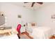 Bedroom with a queen-size bed, workspace, and hardwood floors at 1039 10Th N St, St Petersburg, FL 33705