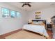 Spacious bedroom with hardwood floors, king-size bed, and ample natural light at 1039 10Th N St, St Petersburg, FL 33705