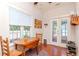 Cozy breakfast nook with a drop-leaf table and chairs near a back door at 1039 10Th N St, St Petersburg, FL 33705