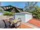 Deck with patio set and umbrella, adjacent to garage at 1039 10Th N St, St Petersburg, FL 33705