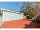 Detached garage with wood siding and backyard view at 1039 10Th N St, St Petersburg, FL 33705