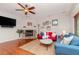 Bright living room with hardwood floors, fireplace and ample seating at 1039 10Th N St, St Petersburg, FL 33705