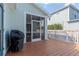 Screened deck with wood flooring, grill, and access to backyard at 1039 10Th N St, St Petersburg, FL 33705