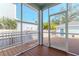 Screened porch with wood deck and backyard view at 1039 10Th N St, St Petersburg, FL 33705